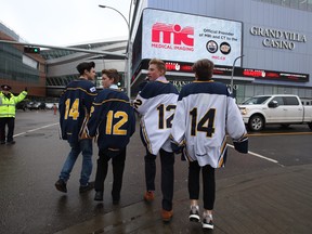 A group of boys make their way towards Rogers Place for a public celebration of the lives of four Edmonton-area Humboldt Broncos hockey players on Tuesday, April 17, 2018.