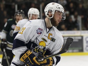 Spruce Grove Saints captain Josh Harris reacts to a missed shot on Okotoks Oilers Riley Morris (33) during the first period of Game 4 of the AJHL finals at Grant Fuhr Arena in Spruce Grove, on Tuesday, April 17, 2018. Harris scored the winning goal in Game 5 in Okotoks on Friday.