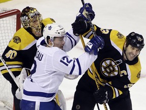 Toronto Maple Leafs forward Patrick Marleau (12) struggles for position against Boston Bruins defenceman Zdeno Chara in front of Bruins goaltender Tuukka Rask during Game 1 of their first-round playoff series Thursday, April 12, 2018, in Boston. (AP Photo/Elise Amendola)