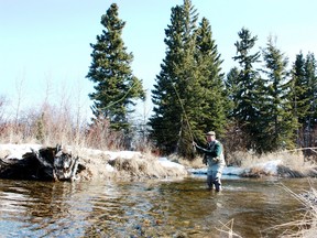 Neil fishing open-water on the North Raven River under spring conditions.