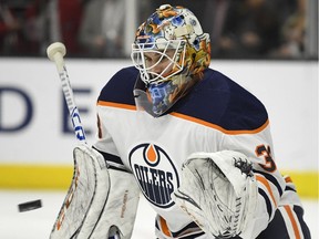 Edmonton Oilers goaltender Cam Talbot makes a glove save during NHL action on Feb. 24, 2018, against the host Los Angeles Kings.