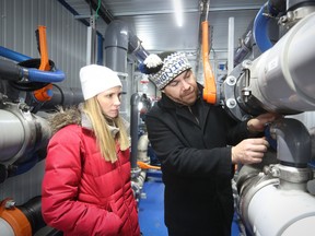 Peter Christou, Swirltex CEO and inventor of a new wastewater treatment process, and Melanie McClare, Swirltex COO, inspect the wastewater treatment plant in Ponoka, Alta.