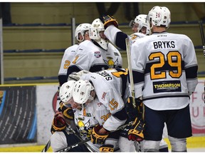 The Spruce Grove Saints console each other after getting defeated by the Wenatchee Wild 7-2 during game 5 of the Doyle Cup at Grant Fuhr Arena in Spruce Grove, May 4, 2018.