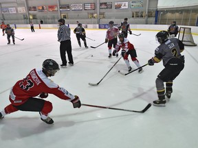 Players take to the ice in the Hockey Helps the Homeless fundraiser at the Terwillegar Rec Centre on May 11. Ed Kaiser/Postmedia