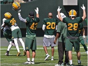 Cheers from the defense on a defensive play during the Eskimos training camp at Commonwealth Stadium in Edmonton, May 22, 2018.