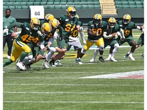 Eskimos denfense on the run during training camp at Commonwealth Stadium in Edmonton, May 22, 2018.