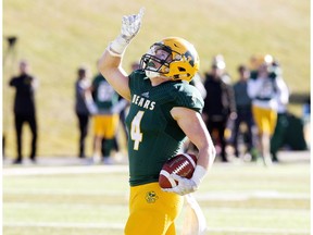 University of Alberta Golden Bears' Ed Ilnicki (4) celebrates a first quarter touchdown against the Saskatchewan Huskies, in Edmonton Saturday Oct. 21, 2017.