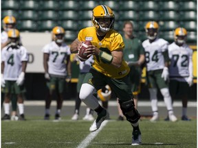 Mike Reilly (13) takes part in the second day of the Edmonton Eskimos' training camp at Commonwealth Stadium, in Edmonton Monday May 21, 2018.