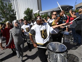 LAS VEGAS, NV - MAY 30:  Cast members from "O by Cirque du Soleil" perform with the Vegas Golden Knights Knight Line Drumbots during The March to the Fortress at Toshiba Plaza before Game Two of the 2018 NHL Stanley Cup Final between the Golden Knights and the Washington Capitals at T-Mobile Arena on May 30, 2018 in Las Vegas, Nevada. The Capitals defeated the Golden Knights 3-2.