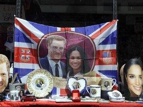 Merchandise is displayed for sale in a shop window in Windsor, England, Monday, May 14, 2018. Preparations are being made in the town ahead of the wedding of Britain's Prince Harry and Meghan Markle that will take place in Windsor on Saturday May 19.