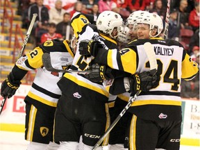 Hamilton Bulldogs Connor Walters and Arthur Kaliyev celebrate team's first goal against Soo Greyhounds goalie Matthew Villalta during first-period action of Game 5 of Ontario Hockey League championship series at Essar Centre in Sault Ste. Marie, Ont., on Friday, May 11, 2018.