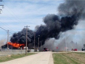 A tire shop in Edson, Alberta was engulfed in flames and smoke Saturday afternoon. (Photo by Eric Chan)