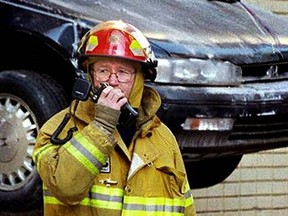 An Edmonton firefighter provides an update on his radio.