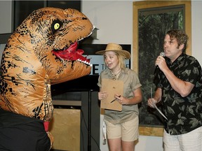 Sophie McKinnon (left) and Murray Utas (right, Fringe Festival Artistic Director) meet a dinosaur during the theme reveal for the 37th Edmonton International Fringe Theatre Festival that will take place in Edmonton from August 16-26, 2018. This year's festival is named "Fringe "O" Saurus Rex", with a theme that will be complimented by found fossils, dinosaur discovery and paleontology prowess.