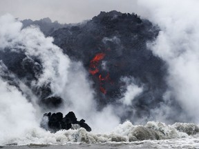In this May 20, 2018 file photo, lava flows into the ocean near Pahoa, Hawaii.