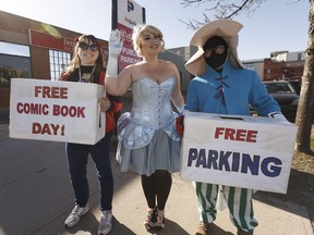 (Left to right) Alia Schamehorn, Candice Ryan (as Cinderella) and Jay Baluyot as Vivi from Final Fantasy 9 welcome visitors during Free Comic Book Day at Happy Harbor Comics in Edmonton, on Saturday, May 5, 2018.