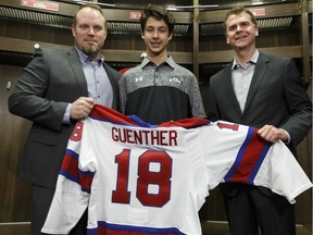 General Manager Randy Hansch (right), Head Coach Steve Hamilton (left) pose for a photo with first round draft pick Dylan Guenther during an Edmonton Oil Kings press conference at Rogers Place in Edmonton, on Thursday, May 10, 2018. Photo by Ian Kucerak/Postmedia