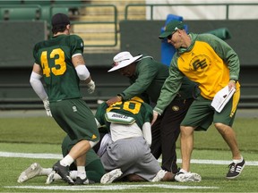 Coaches break up a fight between Johnny Adams (20) and Jamill Smith (4) during Edmonton Eskimos training camp at Commonwealth Stadium in Edmonton, on Tuesday, May 29, 2018.