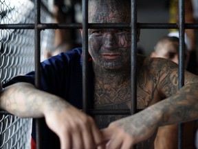 A member of Mara Salvatrucha gang poses at the prison of Ciudad Barrios, east of San Salvador, El Salvador, on June 19, 2012. (JOSE CABEZAS/AFP/Getty Images)