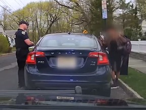 A New Jersey school board official allegedly called the police chief a "skinhead cop" after being pulled over for speeding. (YouTube/NJ.com)