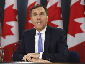 Finance Minister Bill Morneau speaks about the Trans Mountain Expansion project at a press conference in Ottawa on Wednesday, May 16, 2018. THE CANADIAN PRESS/ Patrick Doyle ORG XMIT: PD103