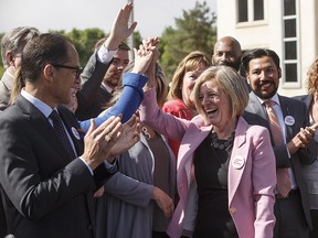 Alberta Premier Rachel Notley is applauded at a press conference after speaking about the Kinder Morgan pipeline project, in Edmonton on Tuesday, May 29, 2018.