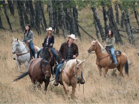 Alisha Newton, Amber Marshall, Chris Potter, Michelle Morgan and Shaun Johnston in a scene from Heartland. Courtesy, Andrew Bako.