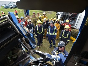 A firefighter uses the jaws of life on a big rig as more than 80 firefighters from across Canada, the United States and Chile participated in vehicle rescue training at the 11th annual 2018 Big Rig HOT (hands-on-training) Symposium at the Nisku Fire District Station on Friday, June 22, 2018.