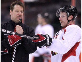 OTTAWA, ONTARIO: JANUARY 10, 2011 -- Daniel alfredsson confers with Coach Brad Lauer (L) as the Ottawa Senators practice at Scotiabank Place in Ottawa, January 10, 2011. Assignment #102954
