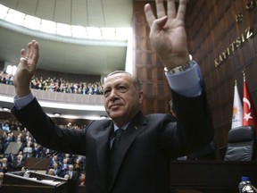 Turkey's President Recep Tayyip Erdogan waves as he arrives to deliver a speech in Ankara, Turkey, Tuesday, Dec. 5, 2017. Erdogan says U.S. recognition of Jerusalem as Israel's capital is a 'red line' for Muslims. (Yasin Bulbul/Pool via AP)