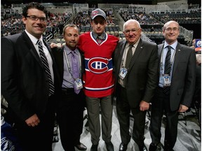 Left to right, scout Ryan Jankowski, scout Trevor Timmons, Tim Bozon, drafted 64th overall by the Montreal Canadiens, scout Elmer Benning and scout Alvin Backus during day two of the 2012 NHL Entry Draft at Consol Energy Center on June 23, 2012 in Pittsburgh, Pennsylvania.