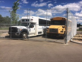 After J.H. Picard School's bus was vandalized back in April, members of the community, including Jamey Bowen, general manager of Derrick Disposal, pitched in to help build an enclosure for the parked busses.