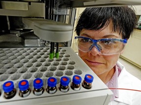 Jodi McDonald watches some cannabis oils being tested at Keystone Labs, a Health Canada accredited testing facility for medical cannabis, pharmaceutical, biotechnology, medical device and nutraceutical related industries in Edmonton, which was recently acquired by American company Evio.