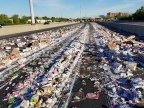 Yogurt covers Hwy. 401 after a transport truck collided with a post near Morningside on Friday, June 22, 2018. (Sonny Subra/Twitter)