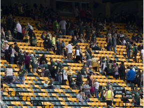 People are asked to walk to the concourse before the opening CFL kickoff of the Edmonton Eskimos, Hamilton Tiger-Cats game on Friday, June 22, 2018 in Edmonton.