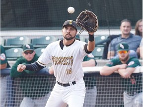 Edmonton's Nick Spillman (16) catches the ball at first as Swift Current's Blake Adams (24) runs during Game 4 of the WMBL final playoff series between the Edmonton Prospects and the Swift Current 57s at Re/Max Field in Edmonton on Wednesday, Aug. 16, 2017.