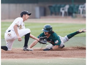 Edmonton's Zane Takhar (6) can't tag Swift Current's Riley Campbell (8) out during Game 4 of the WMBL final playoff series between the Edmonton Prospects and the Swift Current 57s at Re/Max Field in Edmonton on Wednesday, Aug. 16, 2017.