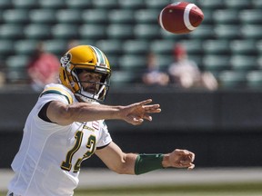 Edmonton Eskimos quarterback Mike Reilly makes a pass against the Saskatchewan Roughriders during first half CFL pre-season action in Edmonton, May 27, 2018.