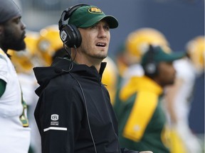 Edmonton Eskimos head coach Jason Maas looks up at the scoreboard during the first half of pre-season CFL action against the Winnipeg Blue Bombers in Winnipeg Friday, June 1, 2018.