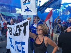 Members of the FC Edmonton supporters group arrive at a launch party for the team joining the Canadian Premier League at Old Strathcona in Edmonton on Friday, June 8, 2018.