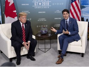 Canada's Prime Minister Justin Trudeau meets with U.S. President Donald Trump at the G7 leaders summit in La Malbaie, Que., on Friday, June 8, 2018.