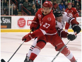 Soo Greyhounds centre Barrett Hayton tries to hold off a check in Ontario Hockey League action at Essar Centre in Sault Ste. Marie, Ont., on Saturday, Dec. 30, 2017.