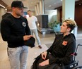 Humboldt Broncos hockey player Ryan Straschnitzki chats with UFC fighter Eddie Alvarez at the Foothills Medical Centre in Calgary, on Wednesday May 30, 2018. Leah Hennel/Postmedia