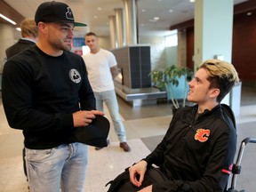 Humboldt Broncos hockey player Ryan Straschnitzki chats with UFC fighter Eddie Alvarez at the Foothills Medical Centre in Calgary, on Wednesday May 30, 2018. Leah Hennel/Postmedia
