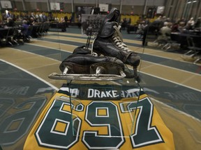 Clare Drake's hockey skates and a commemorative jersey signifying 697 wins are seen after a memorial for legendary University of Alberta Golden Bears hockey coach Clare Drake was held at the Butterdome in Edmonton, on Thursday, June 14, 2018. Photo by Ian Kucerak/Postmedia