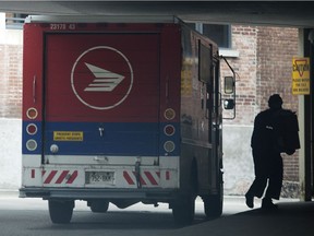 A file photo of a Canada Post Vehicle. The postmaster in the tiny rural hamlet of Perryvale, Alta. has been accused of mail theft.