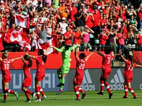 Canada's celebrates beating China during the opening match of the FIFA Women's World Cup Canada 2015 at Commonwealth Stadium in Edmonton, Alberta on Saturday June 5, 2015.