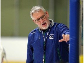 Perry Pearn gives out some instructions during Perry Pearn's 3 on 3 Hockey Camp at Knights of Columbus Arena in Edmonton, Alberta on Thursday August 27, 2015.