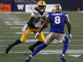 Edmonton Eskimos WR Derel Walker (left) sizes up Winnipeg Blue Bombers DB Chris Randle during CFL action in Winnipeg on Thurs., June 14, 2018.