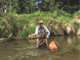 Neil with a fine 16-inch brown trout. (Neil Waugh/Postmedia)